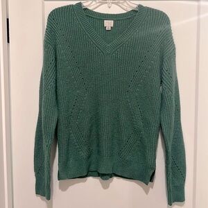 A New Day green sweater